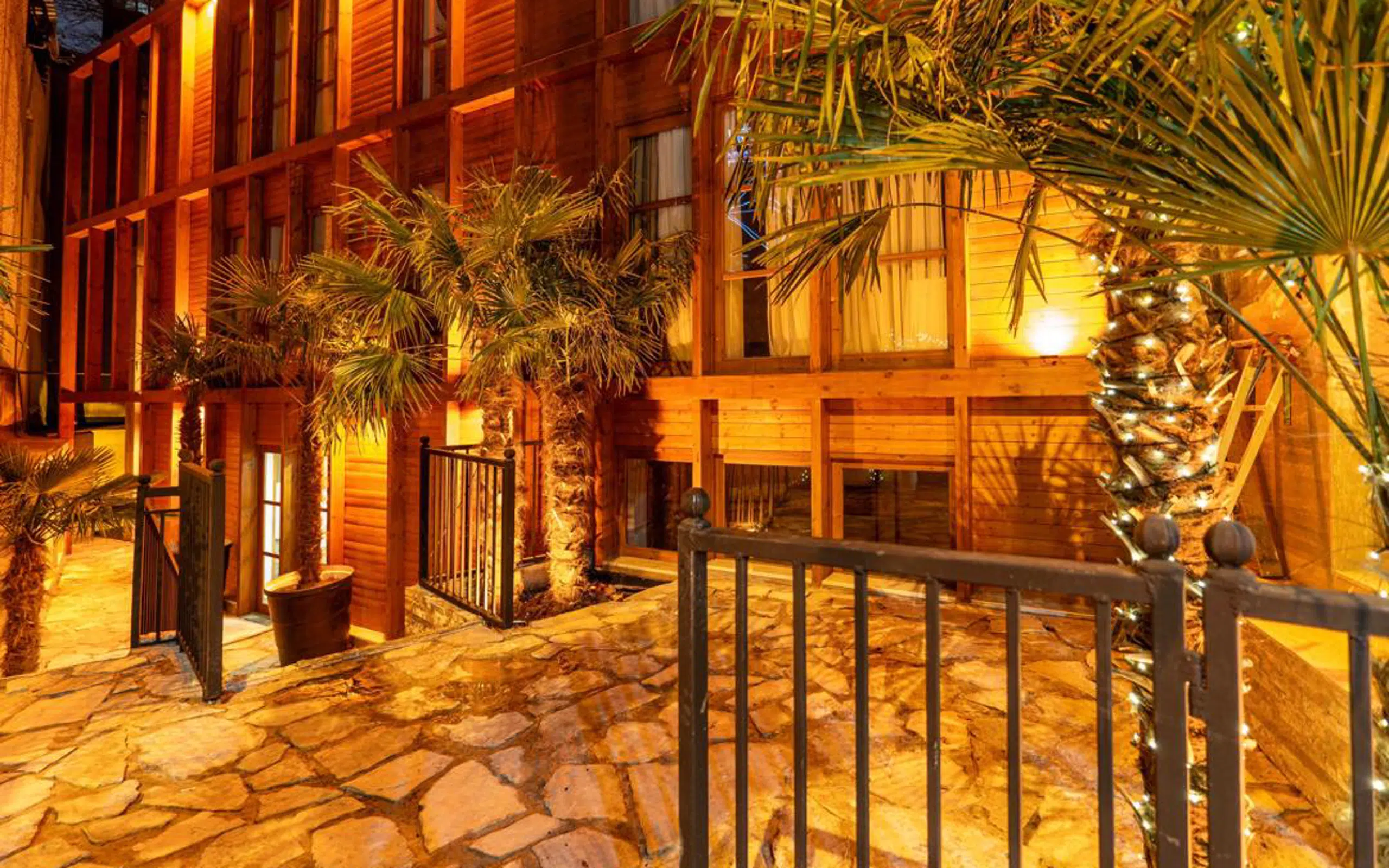 Palm Tbilisi courtyard lit at night